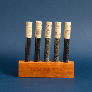 5 glass tubes filled with approx. 9-15g of loose tea each on wooden holder