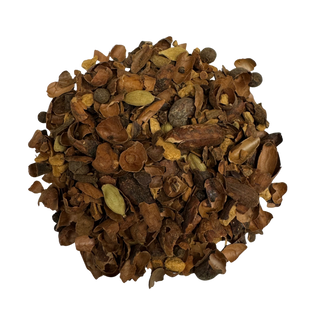 Heap of dried herbs and spices on a white background