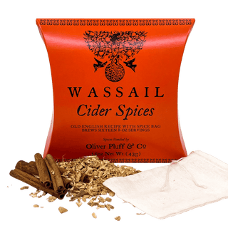 orange tea pouch with halloween crows on label. Loose lead tea and cinnamon sticks sprinkled in front with white tea bag