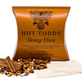 orange firm tea pouch with cinnamon sticks and loose leaf tea sprinkled in front