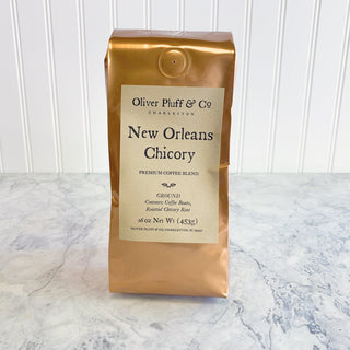 shiny orange coffee bag sitting on white counter